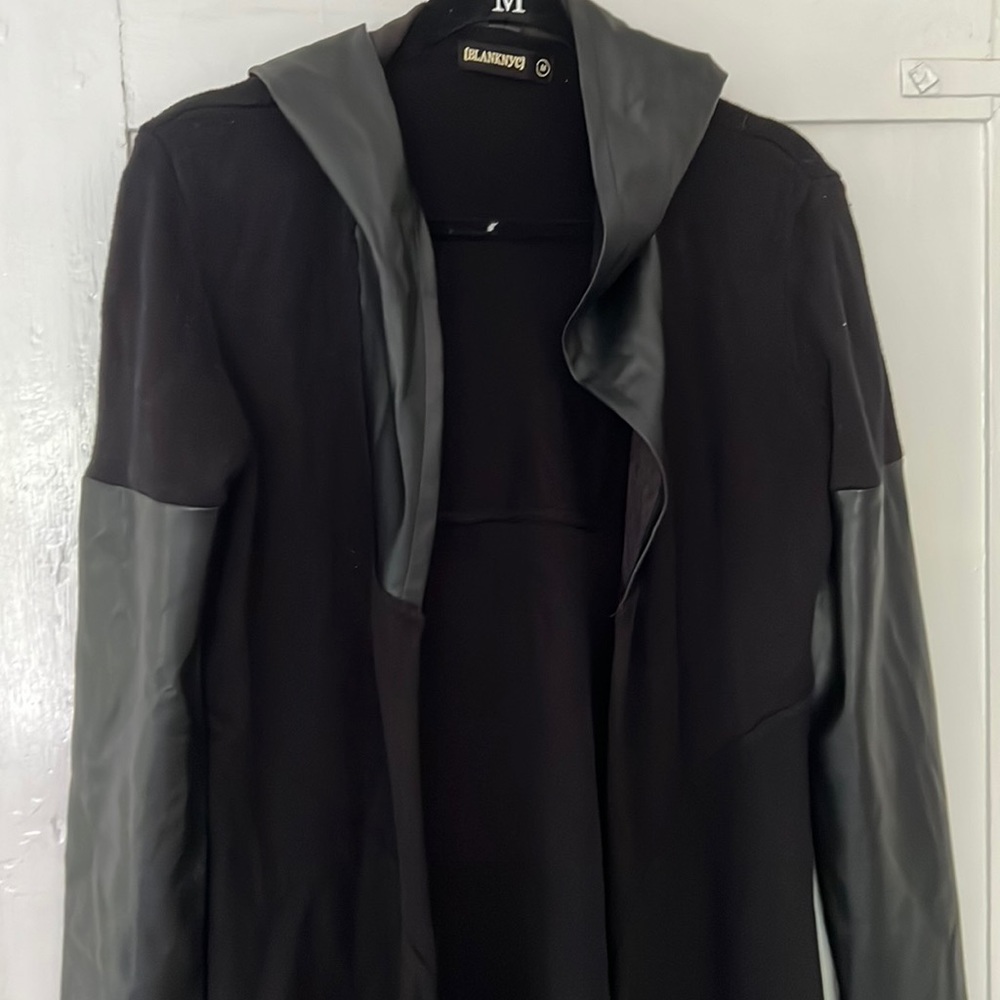 Blank NYC long black cardigan with faux leather hood and sleeves